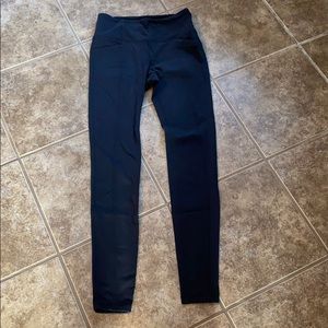 Athleta black leggings with front & back pockets.